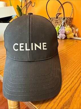 Celine Black Baseball Cap with White Logo looking good